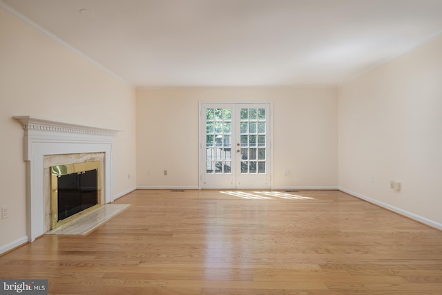 6708 Langston Blvd Unit A, Arlington, VA 22205 - unfurnished living room featuring light wood-style floors, french doors, ornamental molding, and a high end fireplace