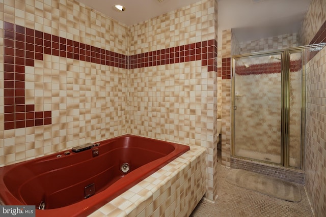 6708 Langston Blvd Unit A, Arlington, VA 22205 - bathroom featuring tile patterned floors, a jetted tub, a shower stall, tile walls, and recessed lighting