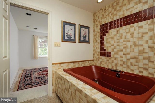 6708 Langston Blvd Unit A, Arlington, VA 22205 - bathroom featuring a jetted tub, tile patterned flooring, recessed lighting, and tile walls