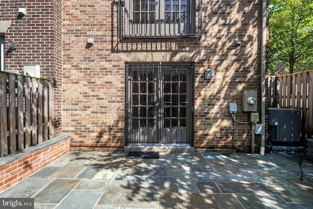 6708 Langston Blvd Unit A, Arlington, VA 22205 - doorway to property featuring french doors, brick siding, and a patio area