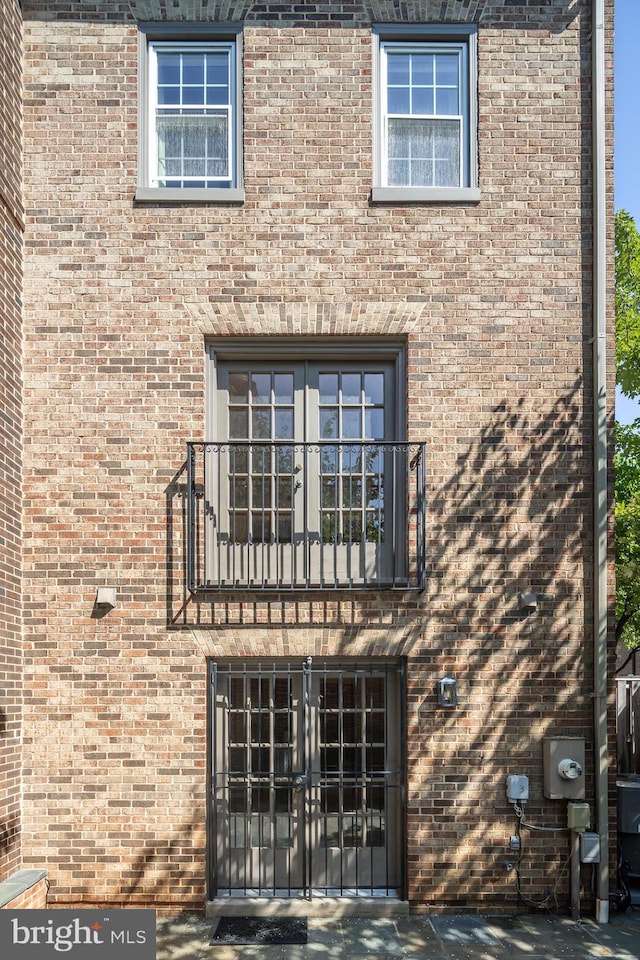 6708 Langston Blvd Unit A, Arlington, VA 22205 - exterior space with a balcony, french doors, and brick siding