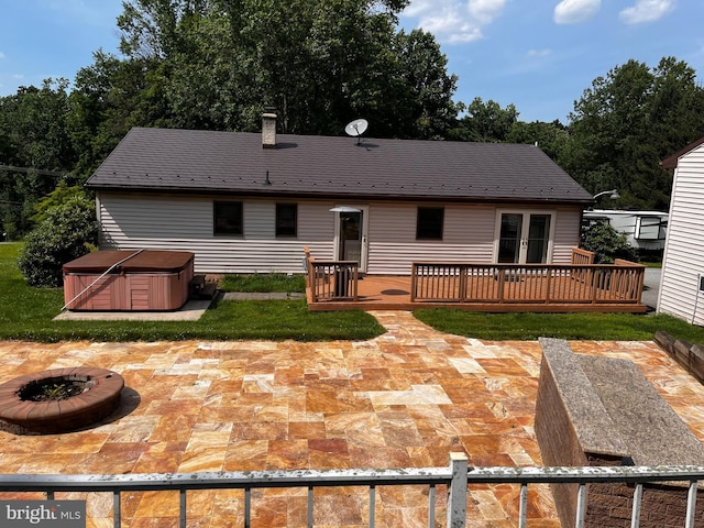 636 Pigeon Creek Rd, Pottstown, PA 19465 - back of property with a hot tub, a patio, a fire pit, and a deck