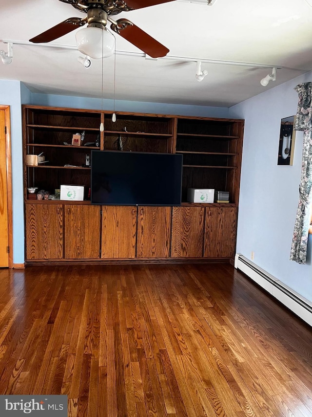 636 Pigeon Creek Rd, Pottstown, PA 19465 - unfurnished living room featuring wood finished floors, a ceiling fan, rail lighting, and a baseboard radiator