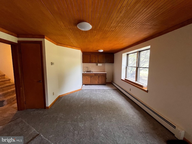 636 Pigeon Creek Rd, Pottstown, PA 19465 - kitchen with a baseboard heating unit, light colored carpet, wood ceiling, brown cabinets, and light countertops