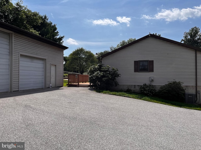 636 Pigeon Creek Rd, Pottstown, PA 19465 - view of property exterior with a garage, a deck, and asphalt driveway