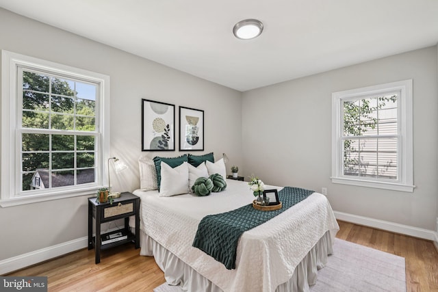 202 Piping Rock Dr, Silver Spring, MD 20905 - bedroom with multiple windows and wood finished floors