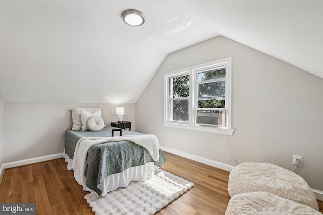 202 Piping Rock Dr, Silver Spring, MD 20905 - bedroom featuring wood finished floors, cooling unit, and vaulted ceiling