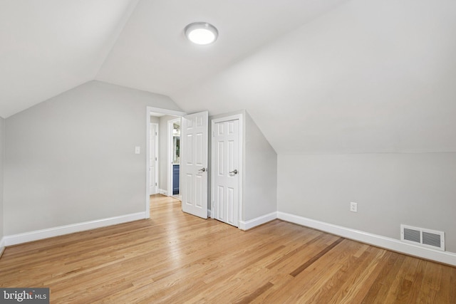 202 Piping Rock Dr, Silver Spring, MD 20905 - bonus room featuring light wood-style flooring and vaulted ceiling