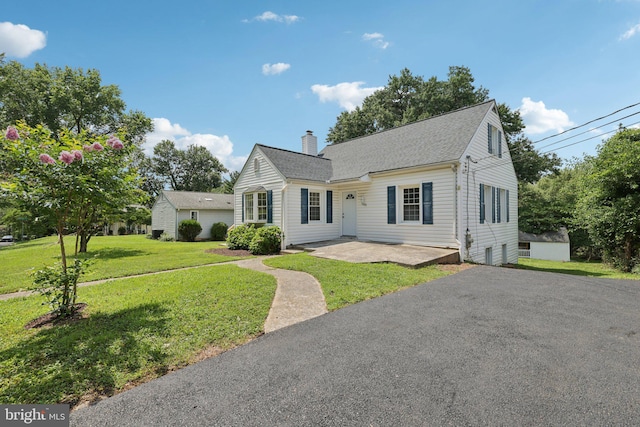 202 Piping Rock Dr, Silver Spring, MD 20905 - view of front facade featuring a chimney, roof with shingles, and a front lawn