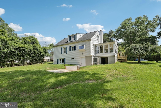 202 Piping Rock Dr, Silver Spring, MD 20905 - rear view of house featuring a sunroom, a chimney, a yard, and a patio