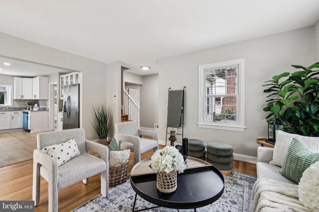 202 Piping Rock Dr, Silver Spring, MD 20905 - living room featuring light wood finished floors, stairway, and recessed lighting