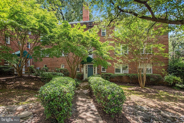 4004 Beecher St NW Unit 304, Washington, DC 20007 - view of front facade with brick siding and a chimney
