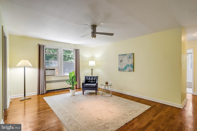 4004 Beecher St NW Unit 304, Washington, DC 20007 - living area featuring radiator, ceiling fan, and dark wood-style floors