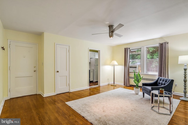 4004 Beecher St NW Unit 304, Washington, DC 20007 - sitting room featuring radiator, wood finished floors, a ceiling fan, and cooling unit