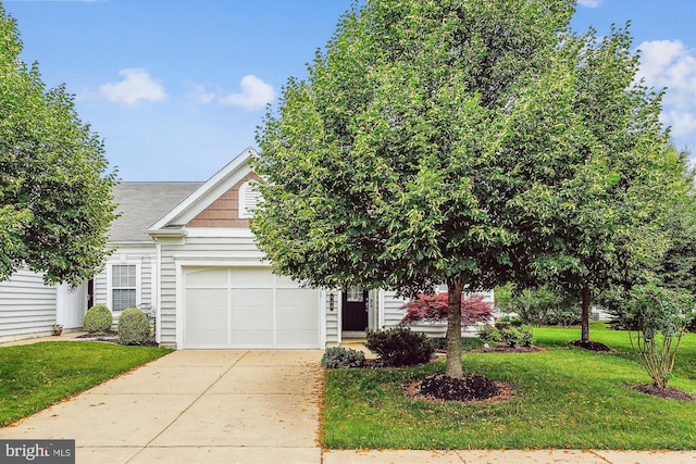 130 Ambrose Ln, Fredericksburg, VA 22406 - view of property hidden behind natural elements with an attached garage, concrete driveway, a front lawn, and roof with shingles