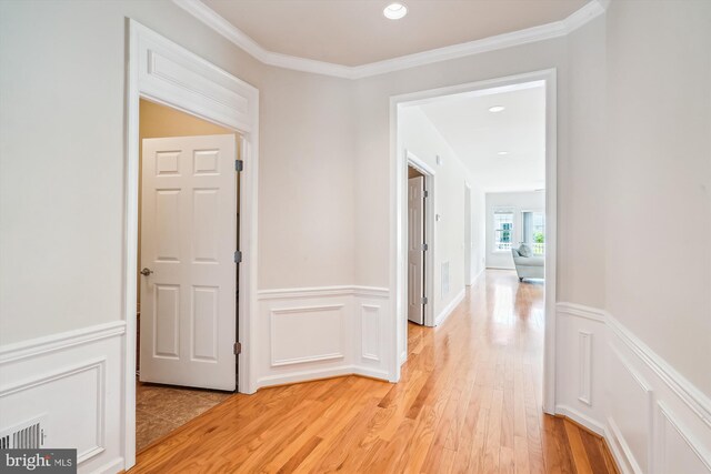 130 Ambrose Ln, Fredericksburg, VA 22406 - hall with light wood-type flooring, a wainscoted wall, crown molding, recessed lighting, and a decorative wall