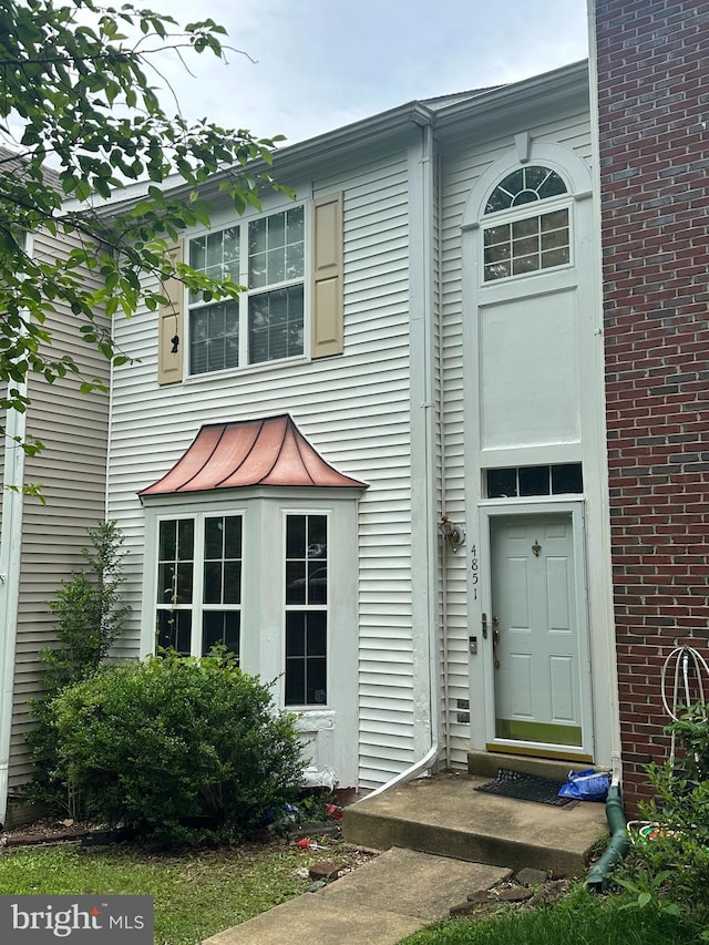 4851 Ebb Tide Ct, Dumfries, VA 22025 - view of front of property featuring a standing seam roof, a metal roof, and brick siding