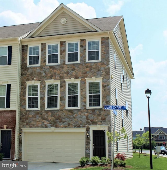 42217 Dean Chapel Sq, Chantilly, VA 20152 - view of front of property with stone siding, an attached garage, and driveway