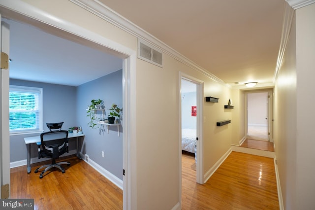 496 Black Swan Ln, Berwyn, PA 19312 - hallway with light wood-style flooring, a desk, and ornamental molding