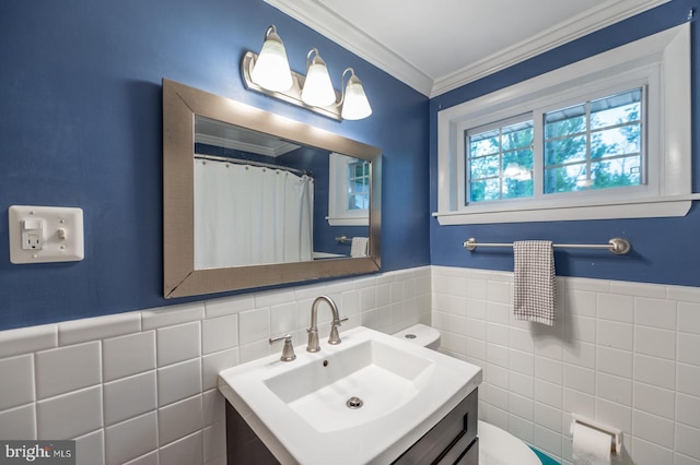 496 Black Swan Ln, Berwyn, PA 19312 - full bathroom featuring tile walls, vanity, ornamental molding, wainscoting, and curtained shower