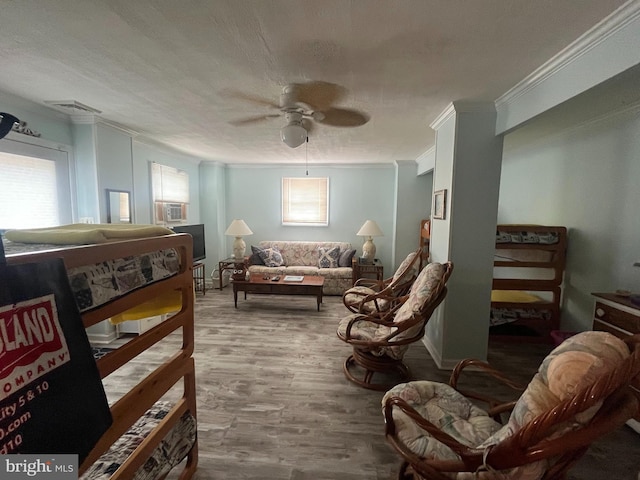 18 N 19th St, Surf City, NJ 08008 - living area with crown molding, a ceiling fan, and wood finished floors