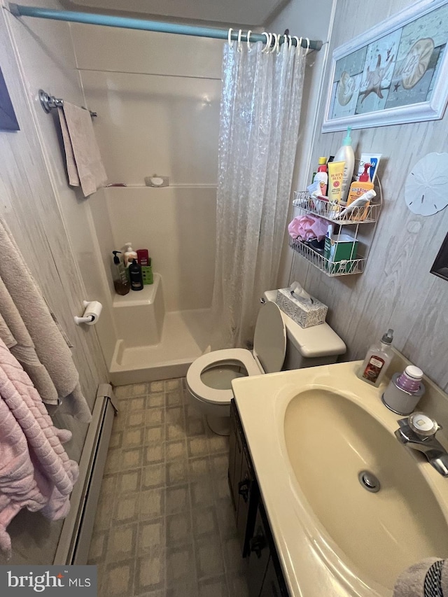 18 N 19th St, Surf City, NJ 08008 - bathroom featuring baseboard heating, a shower stall, vanity, and tile patterned floors