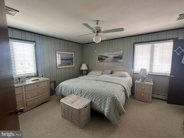 18 N 19th St, Surf City, NJ 08008 - carpeted bedroom featuring multiple windows, ceiling fan, and a baseboard radiator