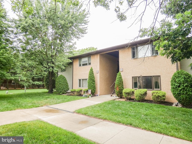 445 Locust Ave Unit 5203, Pitman, NJ 08071 - view of front facade featuring stucco siding and a front yard