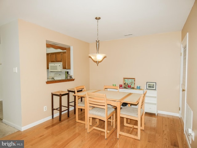 445 Locust Ave Unit 5203, Pitman, NJ 08071 - dining area featuring light wood finished floors and baseboards