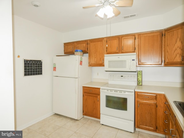 445 Locust Ave Unit 5203, Pitman, NJ 08071 - kitchen with white appliances, brown cabinetry, ceiling fan, light tile patterned floors, and light countertops