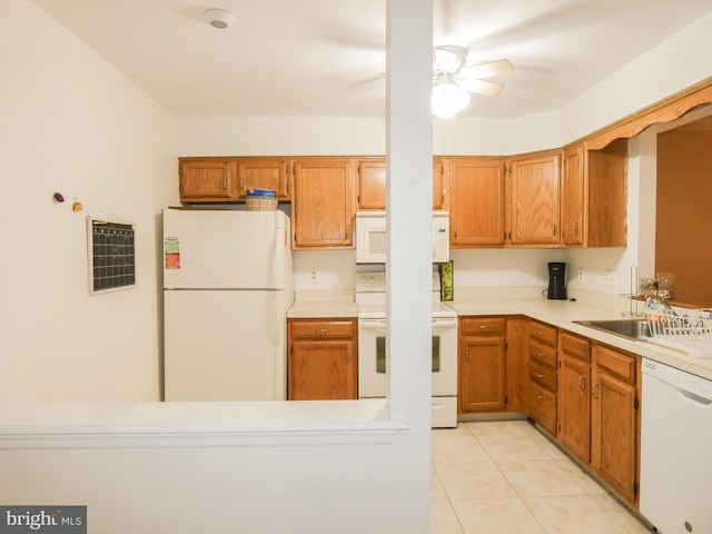 445 Locust Ave Unit 5203, Pitman, NJ 08071 - kitchen featuring white appliances, light tile patterned floors, light countertops, brown cabinetry, and ceiling fan