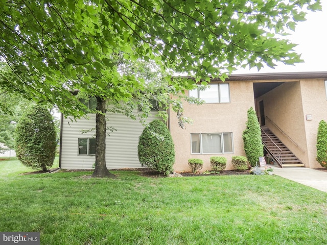 445 Locust Ave Unit 5203, Pitman, NJ 08071 - view of front of property with stucco siding, a front lawn, and stairs