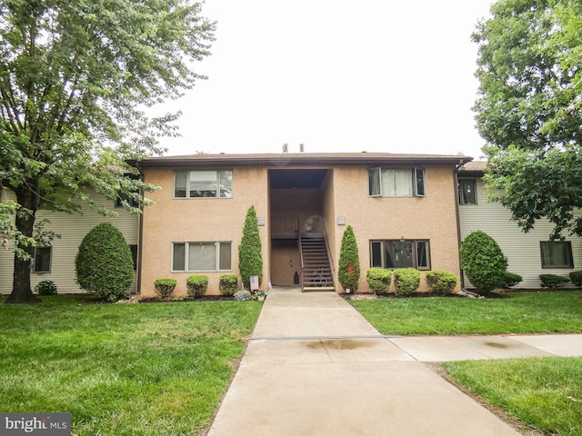 445 Locust Ave Unit 5203, Pitman, NJ 08071 - view of front of house featuring stucco siding, stairs, and a front yard