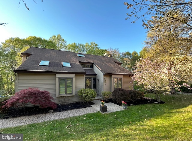 112 Birch Dr, Downingtown, PA 19335 - view of front of house featuring a front lawn, a shingled roof, and a chimney