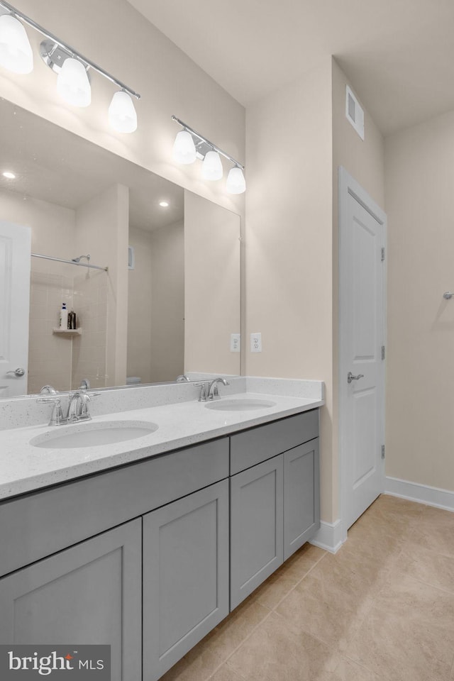 9660 Fields Rd Unit 9660, Gaithersburg, MD 20878 - full bathroom with double vanity, tile patterned flooring, and a shower