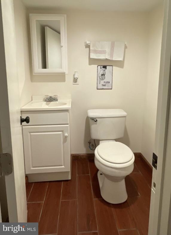433 Williams St, Cumberland, MD 21502 - bathroom featuring vanity and wood finished floors