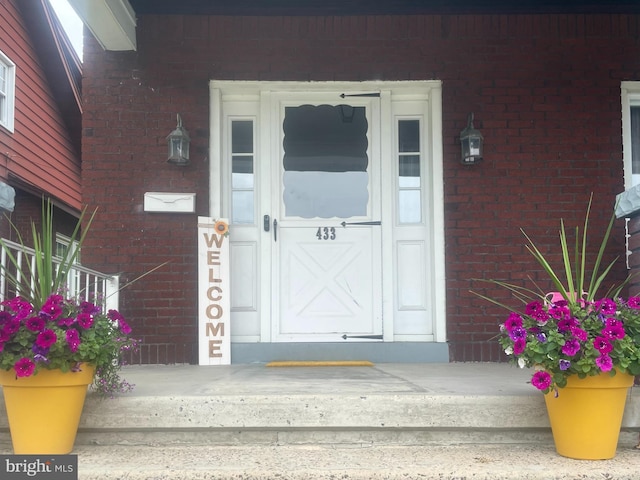 433 Williams St, Cumberland, MD 21502 - doorway to property with brick siding and covered porch