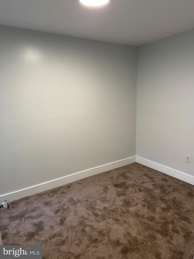 1447 S 28th St, Philadelphia, PA 19146 - empty room featuring dark carpet and baseboards
