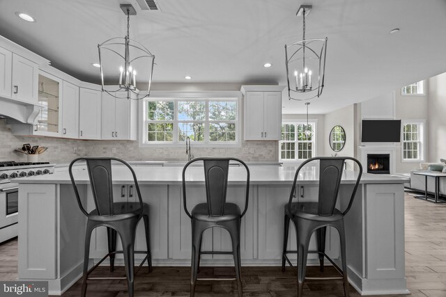 4245 Mechanicsville Rd, Doylestown, PA 18902 - kitchen with a chandelier, gas stove, healthy amount of natural light, and recessed lighting