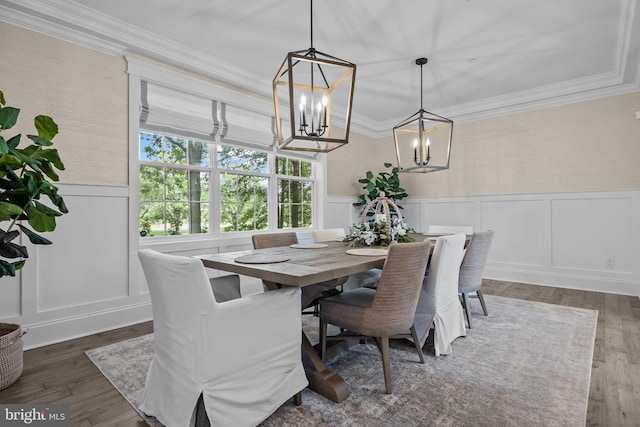 4245 Mechanicsville Rd, Doylestown, PA 18902 - dining room featuring a chandelier, wainscoting, wood finished floors, a decorative wall, and crown molding