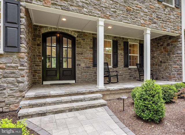 4245 Mechanicsville Rd, Doylestown, PA 18902 - doorway to property with a porch, french doors, and stone siding