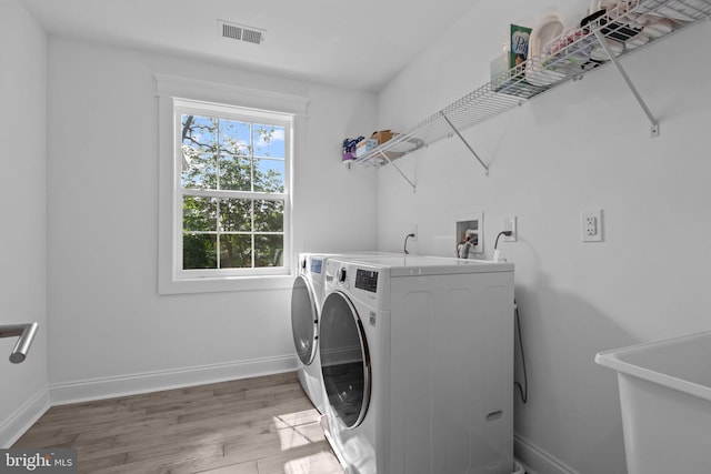 4245 Mechanicsville Rd, Doylestown, PA 18902 - laundry room featuring washer and clothes dryer and light wood-style flooring