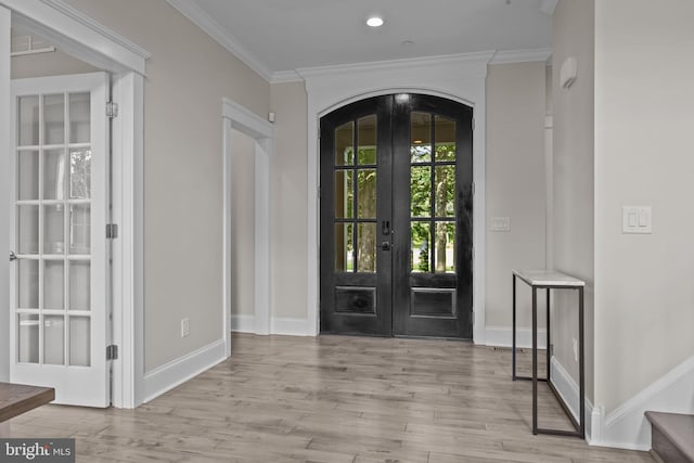 4245 Mechanicsville Rd, Doylestown, PA 18902 - entrance foyer featuring french doors, wood finished floors, arched walkways, and ornamental molding