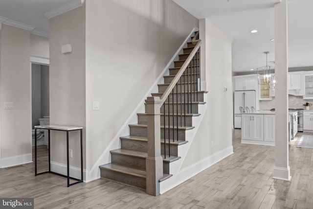 4245 Mechanicsville Rd, Doylestown, PA 18902 - staircase featuring wood finished floors, recessed lighting, and ornamental molding