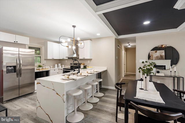 105 Concove Way, Havre De Grace, MD 21078 - kitchen featuring appliances with stainless steel finishes, light wood-type flooring, a peninsula, white cabinetry, and recessed lighting