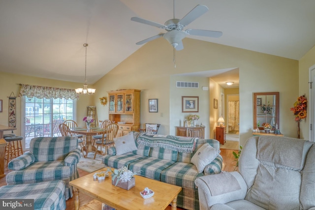 132 Nightingale Dr, Milford, DE 19963 - living room with ceiling fan, light wood-type flooring, high vaulted ceiling, and a chandelier