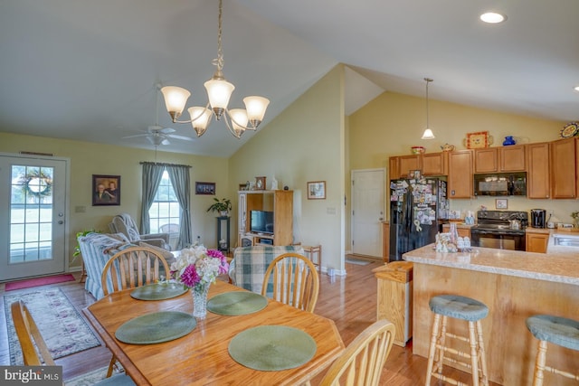 132 Nightingale Dr, Milford, DE 19963 - dining room with light wood-style flooring, ceiling fan, high vaulted ceiling, a chandelier, and recessed lighting