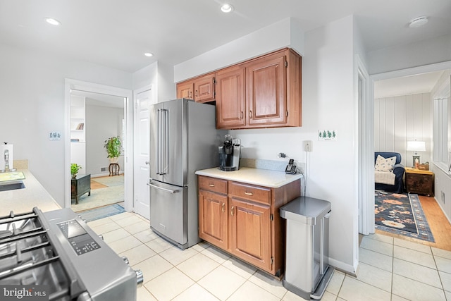 5114 14th St N, Arlington, VA 22205 - kitchen featuring high end refrigerator, light countertops, light tile patterned floors, range, and recessed lighting