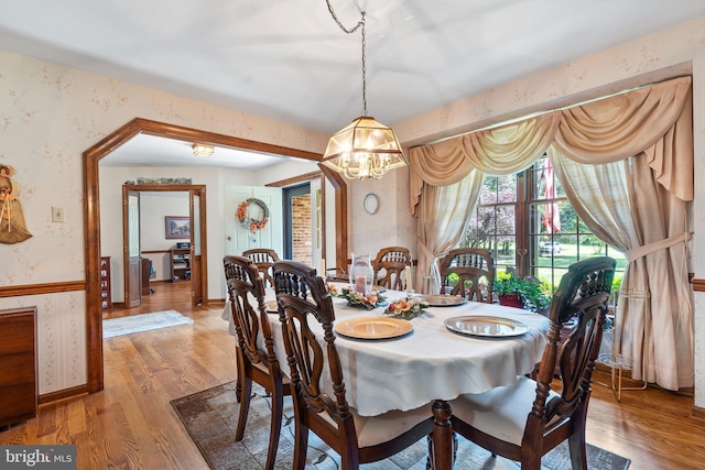 12810 Kending Ln, Clear Spring, MD 21722 - dining space with wallpapered walls, a chandelier, and light wood-style flooring