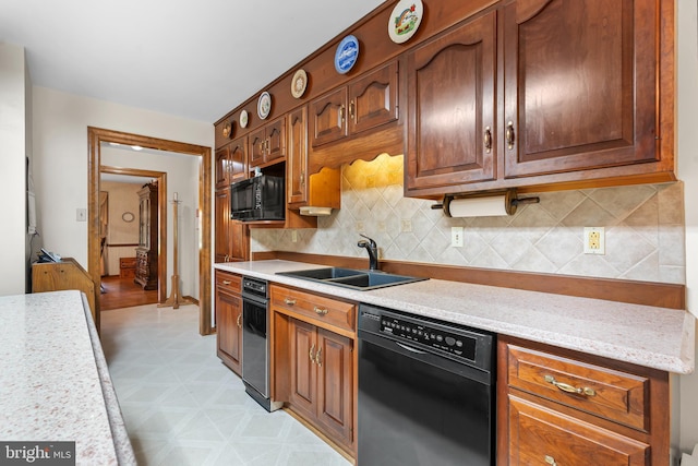 12810 Kending Ln, Clear Spring, MD 21722 - kitchen featuring black appliances, light flooring, and decorative backsplash